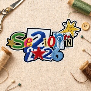 May include: A colorful patch with the text "Senior 2026" in various fonts and colors. The patch includes a gold glitter star, a red star, and a smiling star character. Sewing supplies, including scissors and thread spools, are in the background.