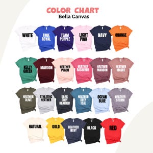 May include: A color chart displays various t-shirt colors from Bella Canvas. The chart includes colors like white, navy, orange, and red. Each shirt sample has the color name printed on it.