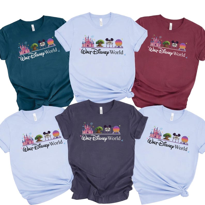 May include: Assorted-color t-shirts featuring a graphic of a castle, tree, Mickey Mouse, and a planet with the text "Walt Disney World." The shirts are in various colors, including blue, teal, burgundy, and gray.