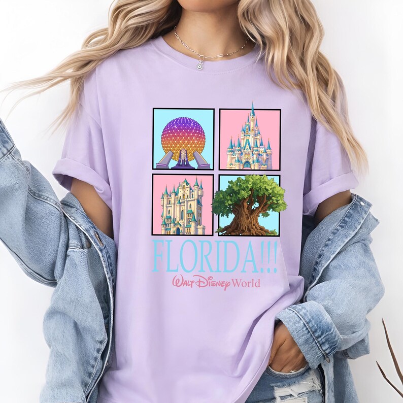 May include: A light purple t-shirt featuring four square images of Disney World landmarks. The images include Spaceship Earth, Cinderella Castle, a castle, and the Tree of Life. The text "FLORIDA!!!" and "Walt Disney World" are below the images.