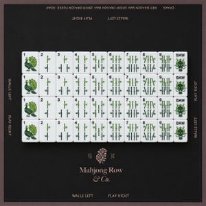 May include: A set of white mahjong tiles arranged in four rows, featuring green bamboo suits numbered one through nine, peacock illustrations, and dragon motifs. The dark background displays the text Mahjong Row & Co. and game instructions.