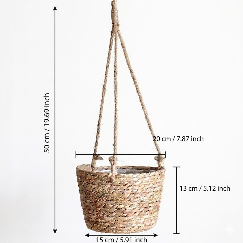 May include: A hanging woven basket with a natural fiber rope. The basket is 5.91 inches wide, 5.12 inches tall, and 7.87 inches across. The total hanging length is 19.69 inches. The basket is made of a light brown woven material.
