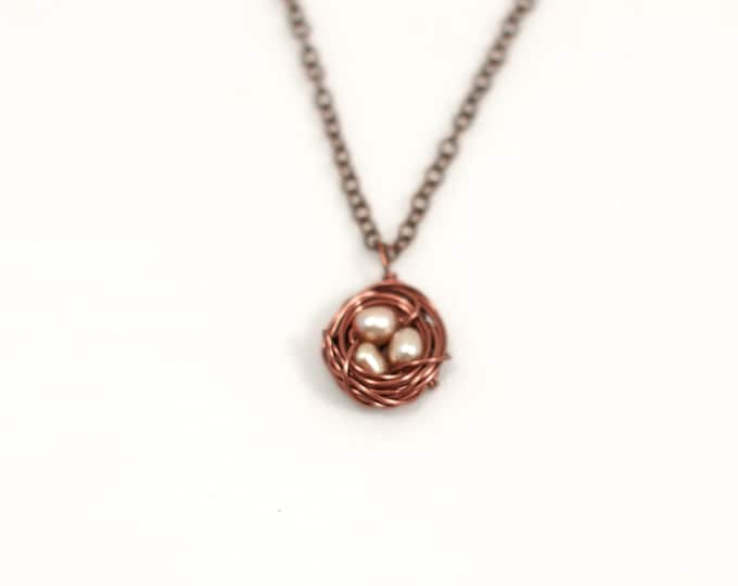 Featured listing image: Tiny Copper Bird Nest Necklace with Three Pink Freshwater Pearls