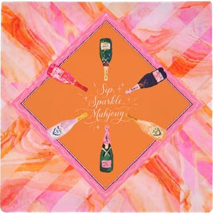 May include: Square, colorful design featuring champagne bottles and the words "Sip, Sparkle, Mahjong." The design has an orange center with a pink border, surrounded by a pink and orange marble pattern.