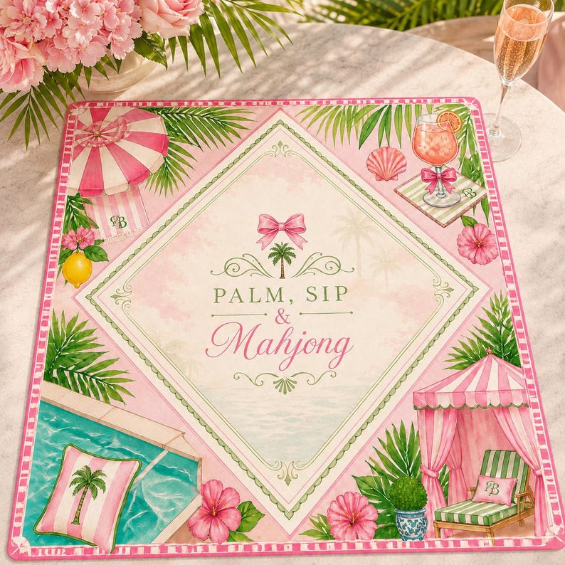 May include: A pink and white placemat with a tropical theme. The placemat features a diamond-shaped design with the words "PALM, SIP & Mahjong". It includes illustrations of a pool, beach umbrella, cocktail, and palm trees.