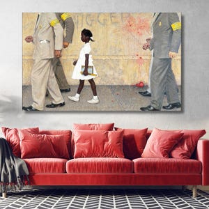 May include: A rectangular wall art print depicting a young girl in a white dress walking between figures in suits with yellow armbands. The background features a beige wall with graffiti and red paint splatters, set above a grey pavement.