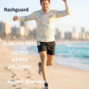 Puede incluir: Un rashguard de manga larga con capucha, de base beige con líneas topográficas azules y marrones. El texto incluye Rashguard, XS-4XL, PDF PATTERN, A0-PDF, A4-PDF, US_Letter e instant download. Se lleva con pantalones cortos deportivos negros.