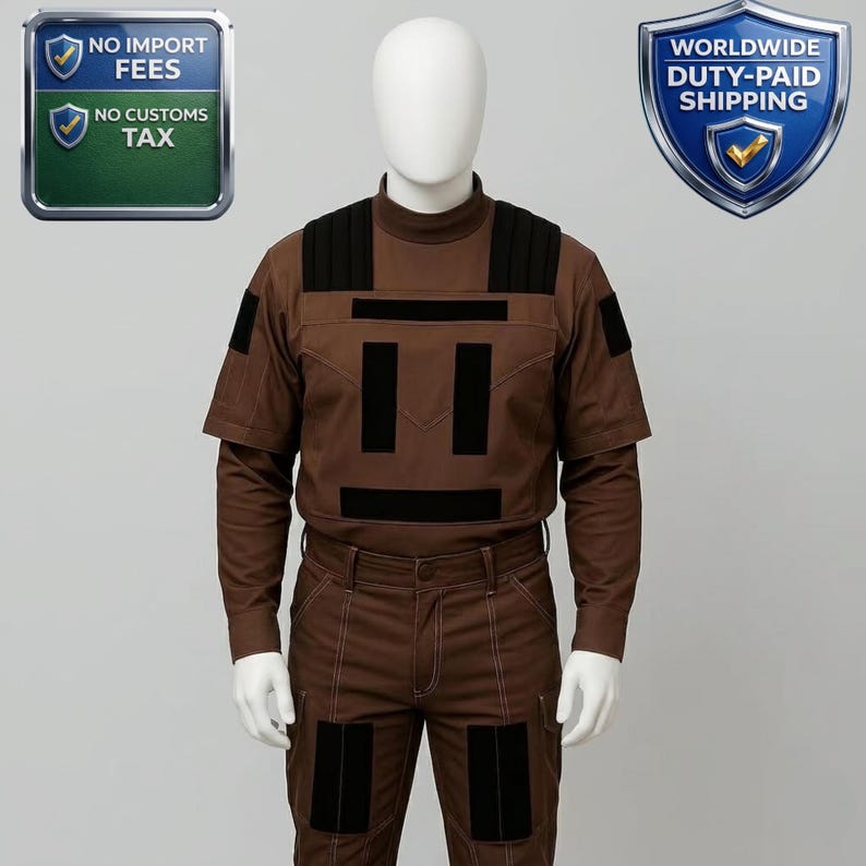 May include: Brown uniform with black accents, displayed on a mannequin. The outfit includes a long-sleeved shirt with short sleeves, pants, and patches. The uniform has a high collar and is designed with multiple pockets and panels.