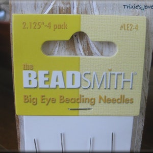 May include: A package of four 2.125 inch big eye beading needles from the Beadsmith brand. The package is yellow and has a hang hole. The needles are silver and are visible through the clear plastic packaging. #LE2-4