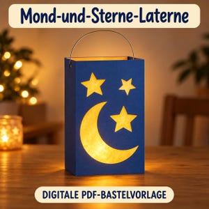 May include: A rectangular blue paper lantern featuring cutouts of a crescent moon and three stars that glow with a warm yellow light. The lantern has a thin metal wire handle at the top. Text at the top reads Mond-und-Sterne-Laterne.