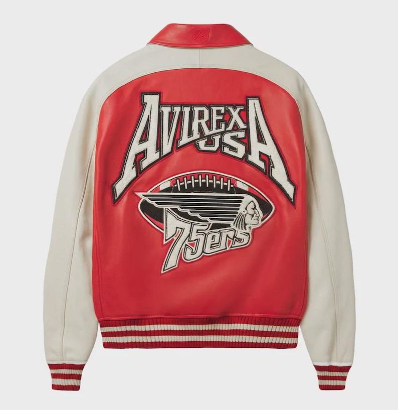 May include: A red and cream-colored leather jacket with the text "AVIREX USA" and a football graphic on the back. The jacket has a ribbed hem and cuffs with red and white stripes. The jacket has a red collar.