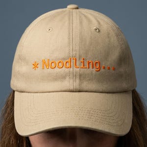 Noodling... Embroidered Dad Hat | Code CLI, AI Humor, Vibe Coding