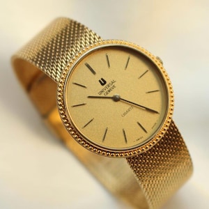Reloj unisex vintage Universal Geneve con esfera redonda y baño de oro