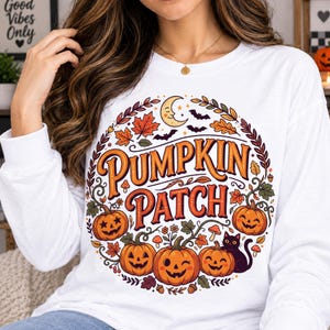 May include: A white long-sleeve shirt featuring a circular graphic with the text PUMPKIN PATCH in orange and red letters. The design includes jack-o'-lanterns, a black cat, autumn leaves, mushrooms, bats, and a crescent moon.