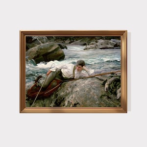 May include: A framed painting shows a person resting on a rock beside a river. The person is dressed in a white shirt, grey trousers, and a cap, with a fishing rod. The artwork is in a gold frame, depicting a tranquil outdoor scene.