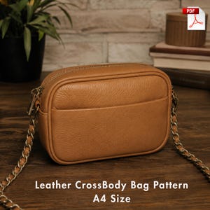 May include: A tan leather crossbody bag with a textured surface, a top zipper closure, and a metallic chain strap. The bag features a rectangular shape with rounded corners and a front slip pocket. The text Leather CrossBody Bag Pattern A4 Size is visible.