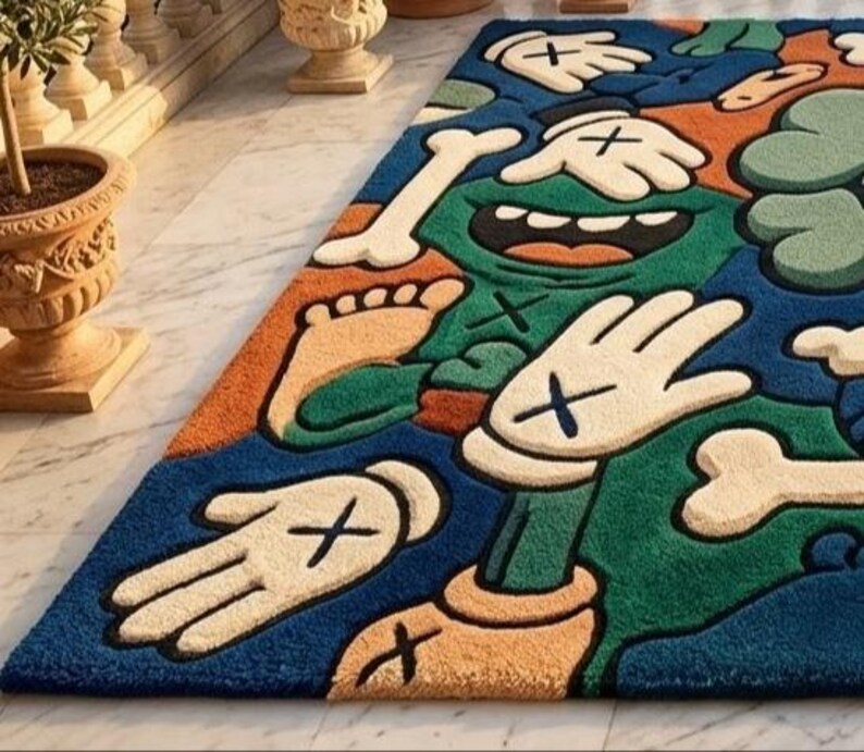 May include: A colorful, cartoon-style rug with a blue background and various shapes. The rug features green, orange, and beige elements, including hands with black crosses, bones, and a foot. The rug is designed for home decor.