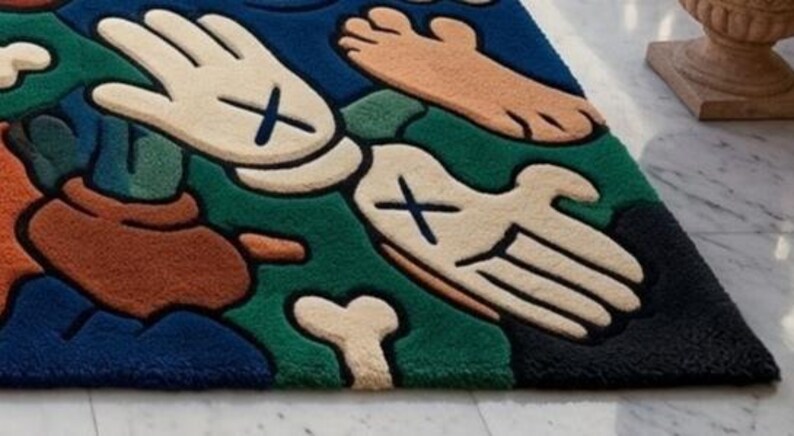 May include: A colorful, cartoon-style rug featuring a playful design. The rug showcases a variety of shapes, including hands, feet, and bones, with a bold color palette of blue, green, beige, brown, and black. The rug is a unique decorative item.