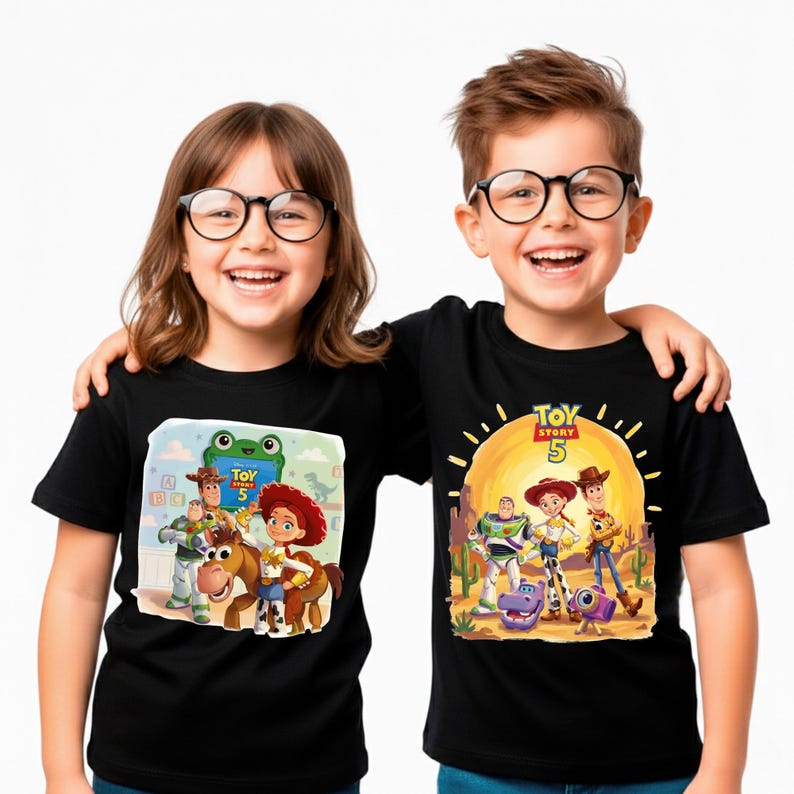 May include: Two children wearing black t-shirts featuring characters from the animated movie "Toy Story 5". The shirts display colorful graphics of Woody, Buzz Lightyear, Jessie, and other characters against a desert backdrop.