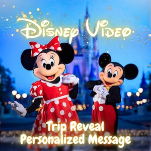 May include: Minnie Mouse in a red and white polka dot dress with a matching bow and Mickey Mouse in a black tuxedo with red trousers stand before a castle. The text Disney Video Trip Reveal Personalized Message is displayed in yellow font.