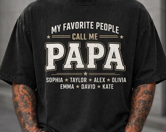 May include: A black short-sleeve t-shirt with a distressed finish featuring the white text MY FAVORITE PEOPLE CALL ME PAPA in a collegiate font, followed by a list of names including Sophia, Taylor, Alex, Olivia, Emma, David, and Kate.