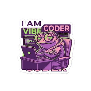 May include: A sticker featuring a cartoon frog wearing glasses and a hoodie, sitting at a desk with a laptop. The text "I AM VIBE CODER" is displayed above the frog. The color scheme includes purple, green, and pink.