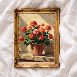 Puede incluir: Pintura enmarcada de una maceta de terracota llena de geranios naranjas y rosas vibrantes. La obra de arte está ambientada contra una pared soleada, con el texto "RETRO TONE Timeless Vintage Prints". El marco es dorado y ornamentado.