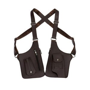May include: A dark brown chest holster bag featuring two main compartments with adjustable shoulder straps. The left side includes a vertical zippered pocket and a flap pocket, while the right side features a larger flap pocket with a snap closure.