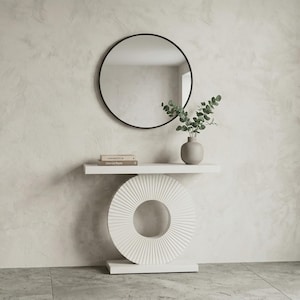 May include: A set of three ceramic mugs with a speckled, matte finish. The mugs are in shades of cream, light gray, and dark gray. Each mug has a simple, minimalist design, perfect for coffee or tea.