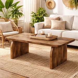 May include: A set of three ceramic mugs with a speckled, matte finish. The mugs are in shades of cream, light brown, and dark brown. Each mug has a simple, minimalist design, perfect for coffee or tea.