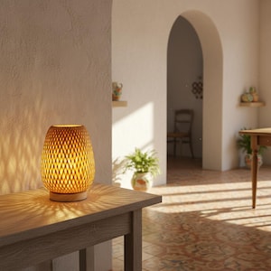 May include: A white ceramic mug with a black handle and the text "But First, Coffee" in a bold, black font. The mug is filled with a dark liquid, likely coffee, and sits on a light-colored surface.