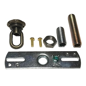 May include: A metal lighting hardware kit including a dark bronze loop finial, two small brass screws, a hexagonal nut, a short threaded pipe, a long threaded pipe, and a rectangular silver mounting bracket with a green ground screw labeled GND.