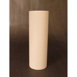 May include: A tall, cylindrical vase with a smooth, matte, off-white finish. The object features a simple, straight-sided design with a flat top opening and a flat base, presenting a clean, uniform appearance without any decorative patterns or textures.
