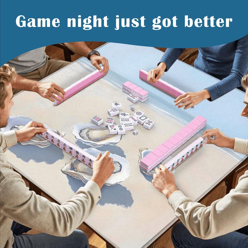 May include: A square mahjong table mat featuring a light beige surface with blue oyster shell illustrations. Four players are positioned around the mat, each with a pink tile rack. The center contains scattered white mahjong tiles. Text reads: Game night just got better.