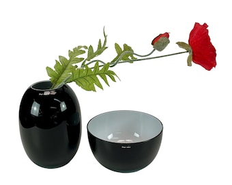 Modern Piet Hein black glass vase and bowl, inner side white, sophisticated Danish design.