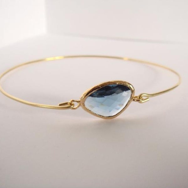 Blue montana faceted glass and gold bangle