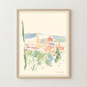 以下が含まれることがあります： ドゥオーモと鐘楼を赤とオレンジで描いたフィレンツェのスカイラインのスケッチが特徴の額入りアートプリント。クリーム色の背景に緑の木々と青い丘が描かれています。右下にアーティストの署名があります。