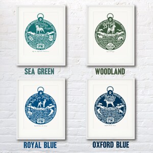 May include: Four framed prints of dog breeds, each with a circular design featuring the breed's name and characteristics. The prints are in four different colors: sea green, woodland, royal blue, and oxford blue.