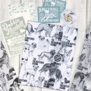 May include: White wrapping paper with a black and white illustration of various dog breeds. The paper has the text "The Enlightened Hound" repeated throughout.