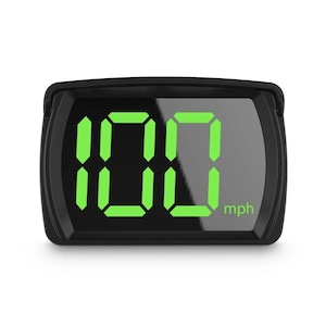 May include: Black digital speedometer showing the number 100 in green, with "mph" displayed. The device has a rectangular shape, suitable for automotive applications. The speed is displayed in miles per hour.