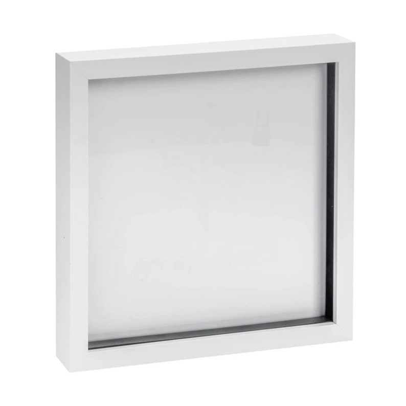May include: White square picture frame with a black mat. The frame is made of wood and has a simple design.