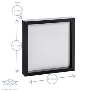 May include: Black square picture frame with a 27.5 inch by 27.5 inch opening and a depth of 3.5 inches.