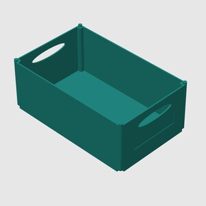 May include: A teal rectangular storage bin with oval-shaped handles on the sides. The bin is empty and has a simple, modern design. The interior and exterior are the same color.