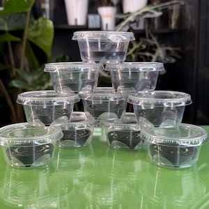 May include: A distressed wooden sign, inscribed with "Welcome to our home" in white lettering. The sign has a rustic finish, ideal for a porch or hallway, creating a welcoming atmosphere.