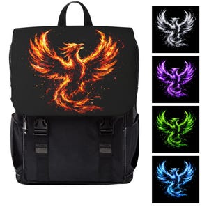 May include: A black backpack featuring a large graphic of a phoenix made of orange and yellow flames on the front flap. The bag has two side pockets, two front buckle straps, and a top handle. Four smaller square swatches show the phoenix in white, purple, green, and blue.