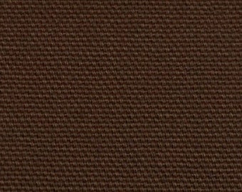 May include: Close-up of a brown woven fabric with a subtle texture. The fabric has a uniform color and a slightly rough feel.