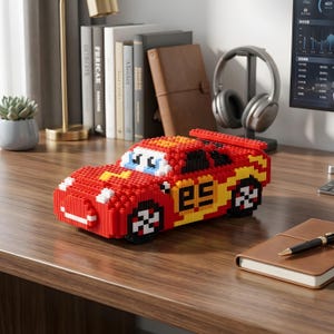 May include: A red and yellow toy race car constructed from interlocking blocks. The car features the number 95 on the side, along with black and white wheels. The car is a detailed replica of a popular animated character.