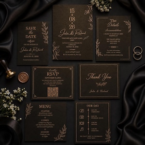 May include: A collection of elegant wedding stationery on a black background. The set includes invitations, RSVP cards, and details cards with gold foil text and floral accents. The text includes the names "Julia & Richard" and the date August 15, 2026.