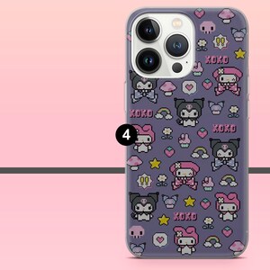 May include: A clear phone case with a purple background featuring a repeating pattern of pixelated cartoon characters, mushrooms, stars, rainbows, and the word "KOKO". The case is on a pink background.