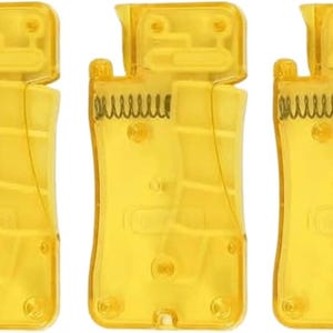 May include: Three transparent yellow plastic tools with a spring mechanism. The tools have a rectangular body with a curved top and a small, hinged section. The internal spring is visible.